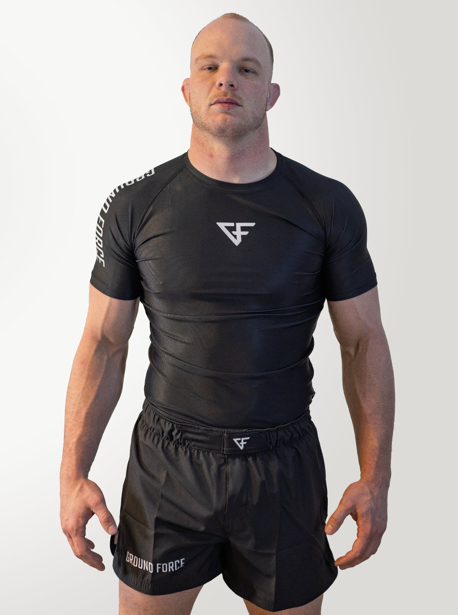 IBJJF World Champion Nick Harman wearing a black Ground Force Nogi set against a white background