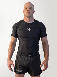IBJJF World Champion Nick Harman wearing a black Ground Force Nogi set against a white background